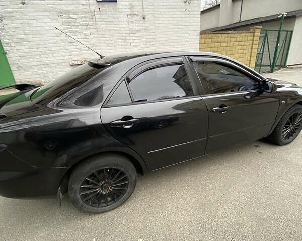 Черный Мазда 6, объемом двигателя 2.3 л и пробегом 173 тыс. км за 4600 $, фото 5 на Automoto.ua