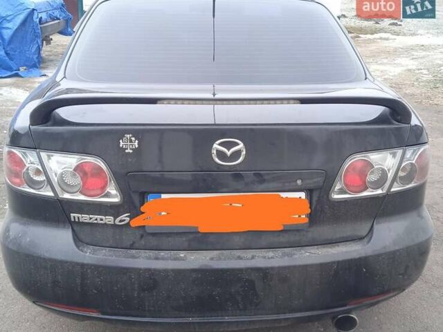 Черный Мазда 6, объемом двигателя 2 л и пробегом 249 тыс. км за 4555 $, фото 1 на Automoto.ua