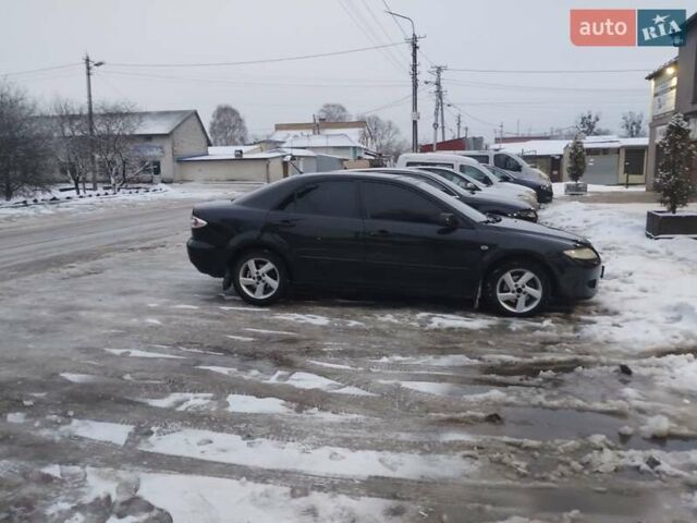 Черный Мазда 6, объемом двигателя 2 л и пробегом 350 тыс. км за 2400 $, фото 1 на Automoto.ua