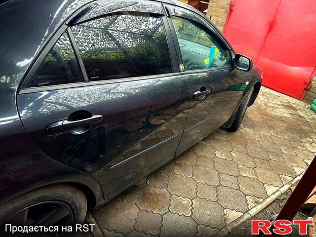 Черный Мазда 6, объемом двигателя 2 л и пробегом 270 тыс. км за 3300 $, фото 1 на Automoto.ua