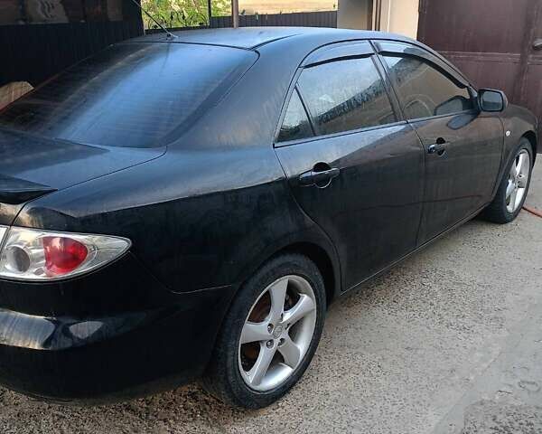 Черный Мазда 6, объемом двигателя 2 л и пробегом 245 тыс. км за 4999 $, фото 1 на Automoto.ua