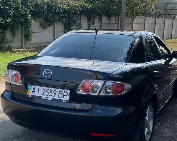Черный Мазда 6, объемом двигателя 2 л и пробегом 375 тыс. км за 3900 $, фото 1 на Automoto.ua