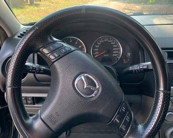 Черный Мазда 6, объемом двигателя 2 л и пробегом 375 тыс. км за 3900 $, фото 4 на Automoto.ua