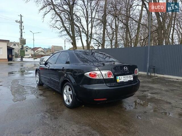 Черный Мазда 6, объемом двигателя 2 л и пробегом 386 тыс. км за 3800 $, фото 1 на Automoto.ua