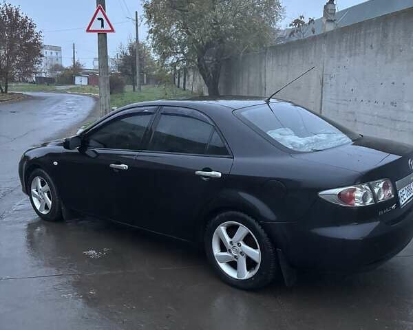 Черный Мазда 6, объемом двигателя 1.8 л и пробегом 301 тыс. км за 3800 $, фото 5 на Automoto.ua
