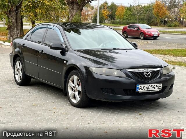 Черный Мазда 6, объемом двигателя 2.3 л и пробегом 250 тыс. км за 3300 $, фото 1 на Automoto.ua