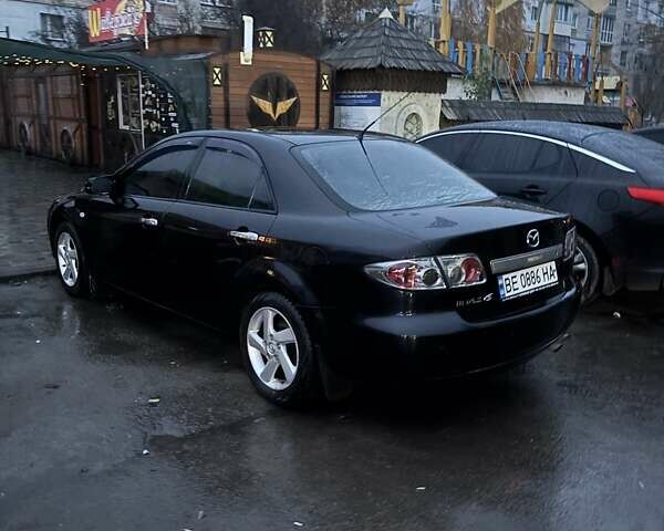 Черный Мазда 6, объемом двигателя 1.8 л и пробегом 301 тыс. км за 3800 $, фото 6 на Automoto.ua