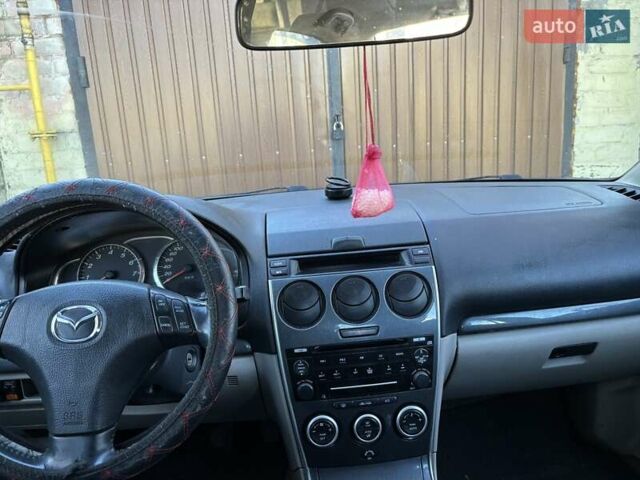 Черный Мазда 6, объемом двигателя 1.8 л и пробегом 301 тыс. км за 3800 $, фото 7 на Automoto.ua