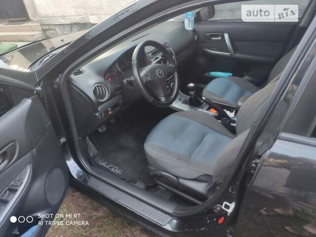 Черный Мазда 6, объемом двигателя 1.8 л и пробегом 250 тыс. км за 4200 $, фото 7 на Automoto.ua