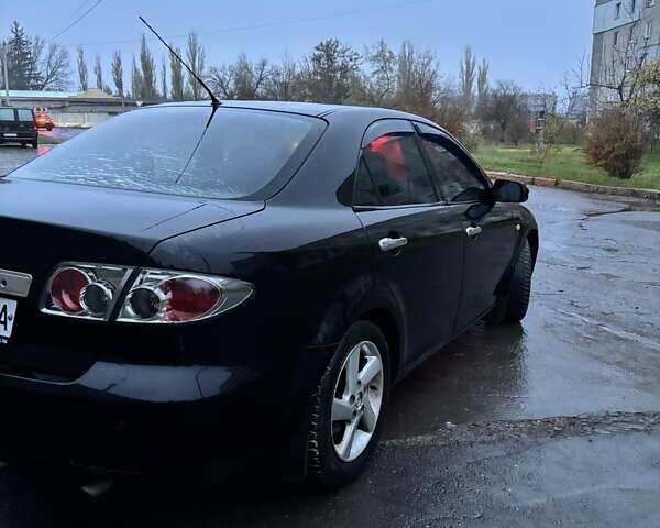 Черный Мазда 6, объемом двигателя 1.8 л и пробегом 301 тыс. км за 3800 $, фото 1 на Automoto.ua