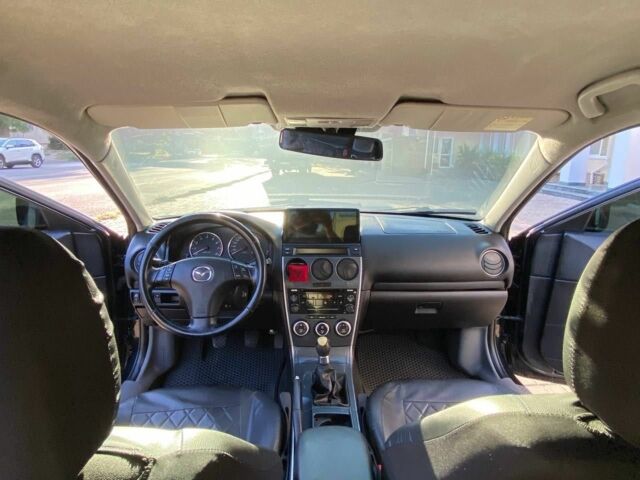 Черный Мазда 6, объемом двигателя 1.8 л и пробегом 235 тыс. км за 3700 $, фото 2 на Automoto.ua