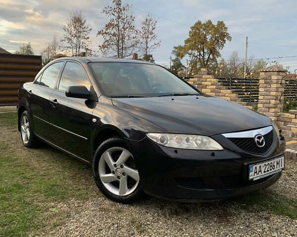 Черный Мазда 6, объемом двигателя 2 л и пробегом 202 тыс. км за 4700 $, фото 1 на Automoto.ua