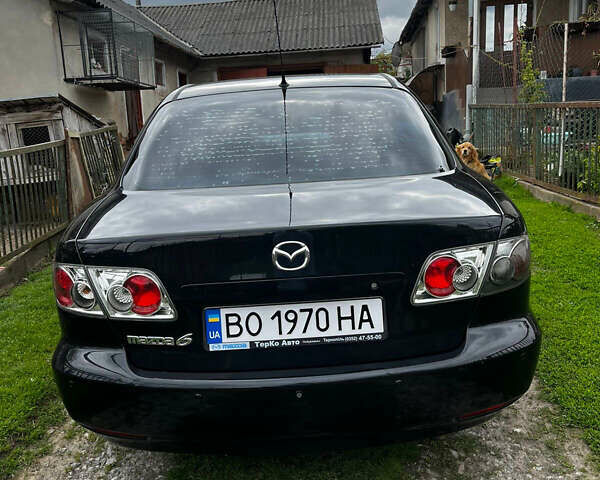 Черный Мазда 6, объемом двигателя 1.8 л и пробегом 210 тыс. км за 4500 $, фото 1 на Automoto.ua
