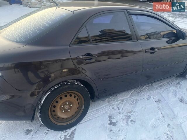 Черный Мазда 6, объемом двигателя 2 л и пробегом 250 тыс. км за 4400 $, фото 5 на Automoto.ua