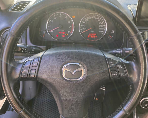 Чорний Мазда 6, об'ємом двигуна 1.8 л та пробігом 235 тис. км за 5500 $, фото 4 на Automoto.ua
