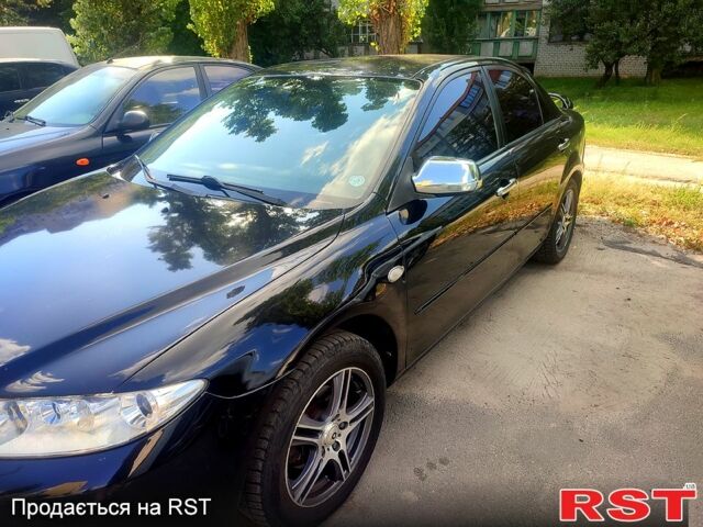 Черный Мазда 6, объемом двигателя 2 л и пробегом 203 тыс. км за 5300 $, фото 1 на Automoto.ua