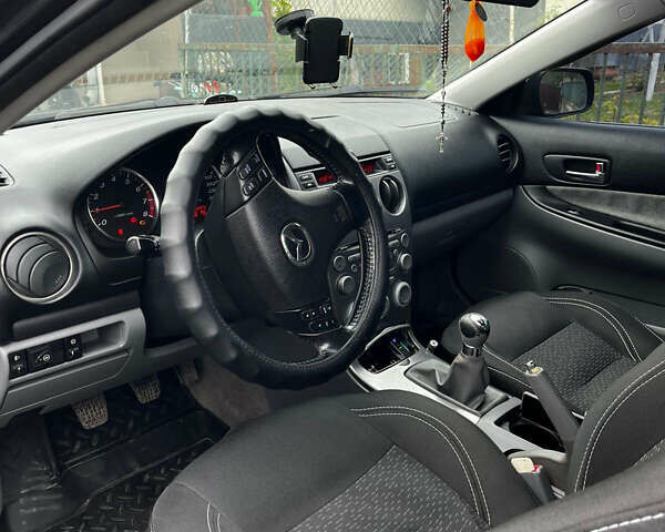 Черный Мазда 6, объемом двигателя 1.8 л и пробегом 210 тыс. км за 4500 $, фото 6 на Automoto.ua