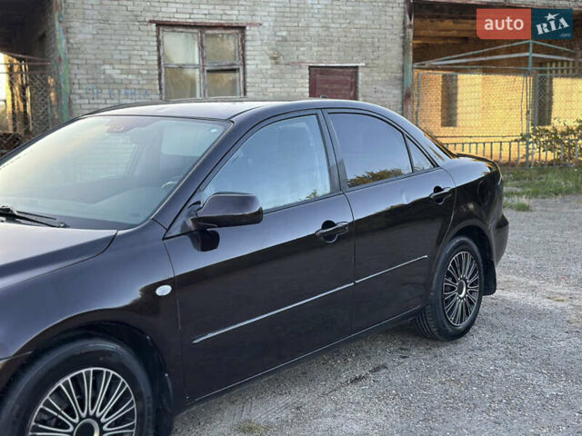 Черный Мазда 6, объемом двигателя 2.3 л и пробегом 220 тыс. км за 3300 $, фото 2 на Automoto.ua