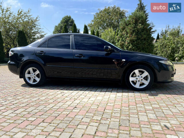 Чорний Мазда 6, об'ємом двигуна 1.8 л та пробігом 308 тис. км за 4599 $, фото 6 на Automoto.ua