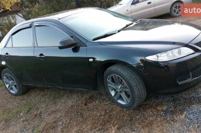 Черный Мазда 6, объемом двигателя 2 л и пробегом 352 тыс. км за 4500 $, фото 2 на Automoto.ua