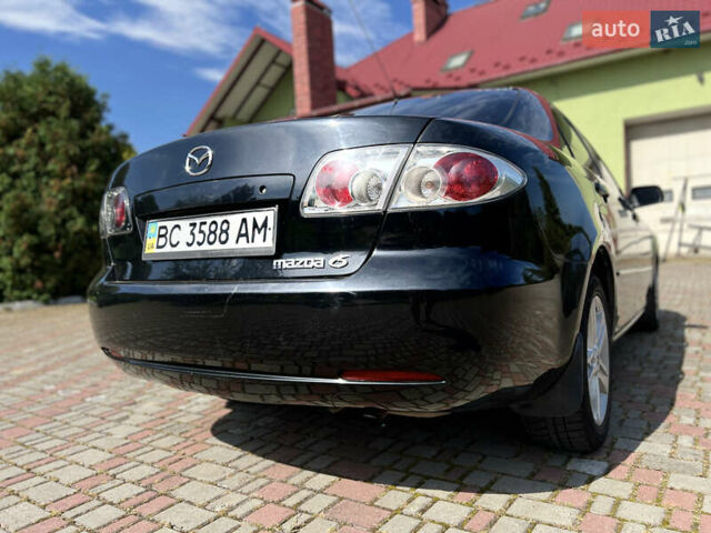 Чорний Мазда 6, об'ємом двигуна 1.8 л та пробігом 308 тис. км за 4599 $, фото 4 на Automoto.ua