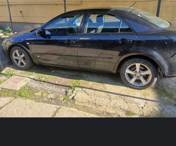 Черный Мазда 6, объемом двигателя 2 л и пробегом 360 тыс. км за 2400 $, фото 1 на Automoto.ua