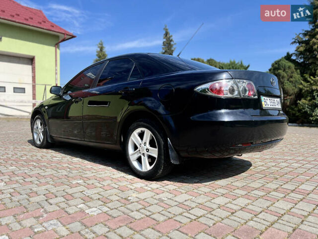 Чорний Мазда 6, об'ємом двигуна 1.8 л та пробігом 308 тис. км за 4599 $, фото 3 на Automoto.ua
