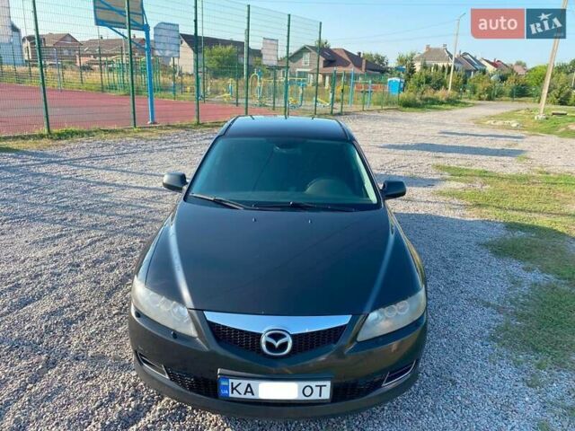 Черный Мазда 6, объемом двигателя 2 л и пробегом 338 тыс. км за 4500 $, фото 1 на Automoto.ua