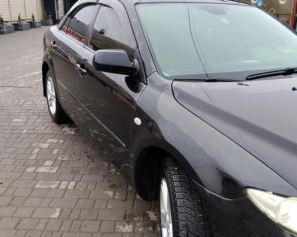 Черный Мазда 6, объемом двигателя 2 л и пробегом 190 тыс. км за 4600 $, фото 1 на Automoto.ua