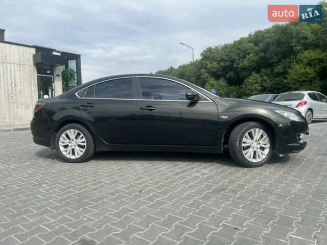 Черный Мазда 6, объемом двигателя 2 л и пробегом 220 тыс. км за 7100 $, фото 1 на Automoto.ua