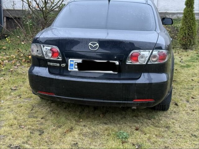 Черный Мазда 6, объемом двигателя 1.8 л и пробегом 245 тыс. км за 1650 $, фото 1 на Automoto.ua