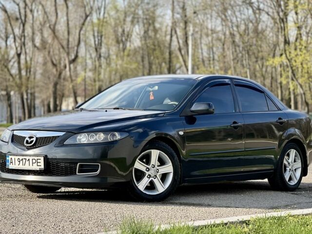Черный Мазда 6, объемом двигателя 2 л и пробегом 314 тыс. км за 5800 $, фото 1 на Automoto.ua