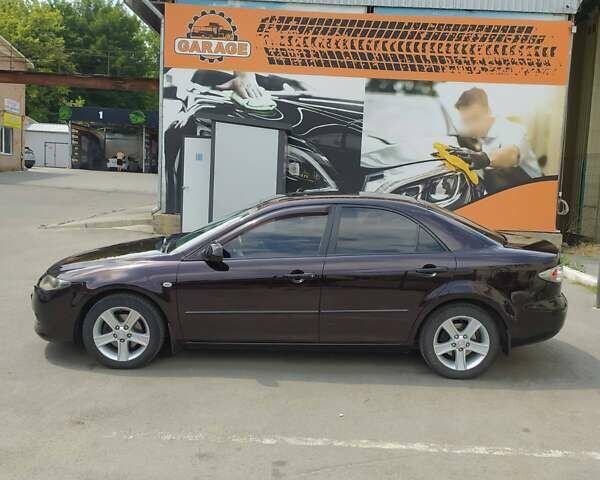 Черный Мазда 6, объемом двигателя 2 л и пробегом 235 тыс. км за 5350 $, фото 1 на Automoto.ua