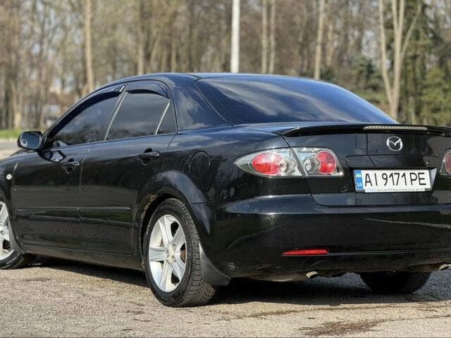 Черный Мазда 6, объемом двигателя 2 л и пробегом 314 тыс. км за 5800 $, фото 6 на Automoto.ua