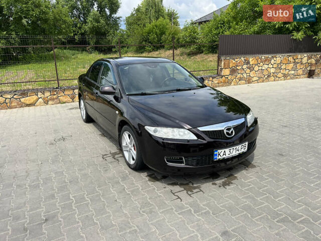 Черный Мазда 6, объемом двигателя 2 л и пробегом 221 тыс. км за 5200 $, фото 1 на Automoto.ua