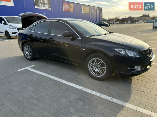 Черный Мазда 6, объемом двигателя 2 л и пробегом 266 тыс. км за 7300 $, фото 1 на Automoto.ua