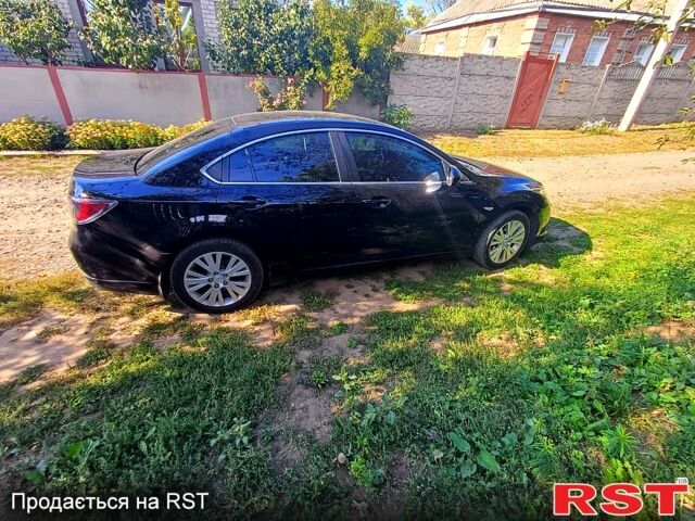 Черный Мазда 6, объемом двигателя 1.8 л и пробегом 215 тыс. км за 7500 $, фото 1 на Automoto.ua