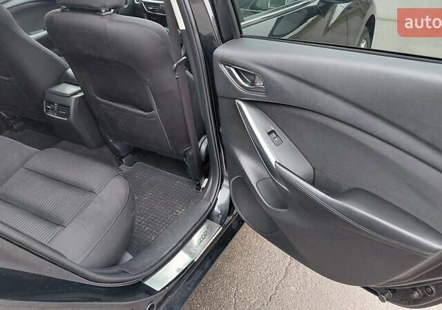 Черный Мазда 6, объемом двигателя 2.49 л и пробегом 94 тыс. км за 12850 $, фото 1 на Automoto.ua