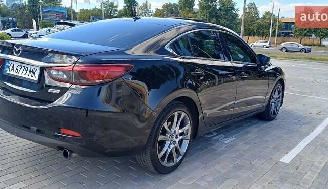 Черный Мазда 6, объемом двигателя 2.49 л и пробегом 210 тыс. км за 11800 $, фото 1 на Automoto.ua