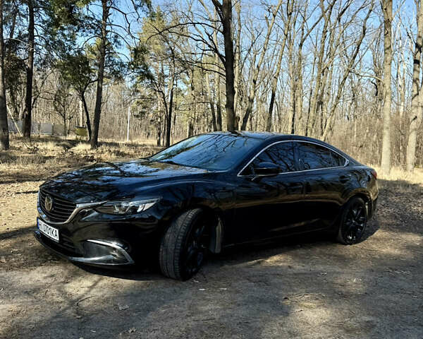 Черный Мазда 6, объемом двигателя 2.49 л и пробегом 124 тыс. км за 14700 $, фото 13 на Automoto.ua