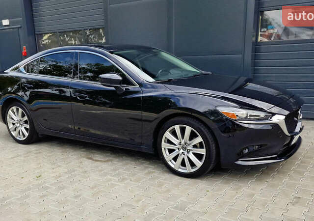 Черный Мазда 6, объемом двигателя 2.49 л и пробегом 100 тыс. км за 15000 $, фото 6 на Automoto.ua
