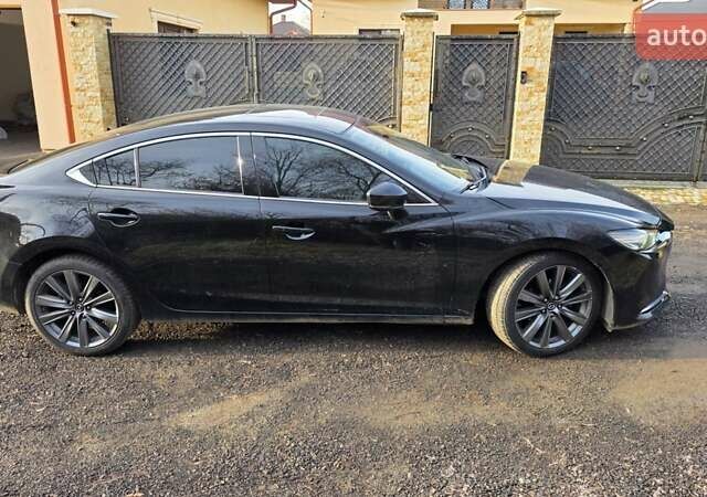 Черный Мазда 6, объемом двигателя 2.49 л и пробегом 97 тыс. км за 17700 $, фото 1 на Automoto.ua