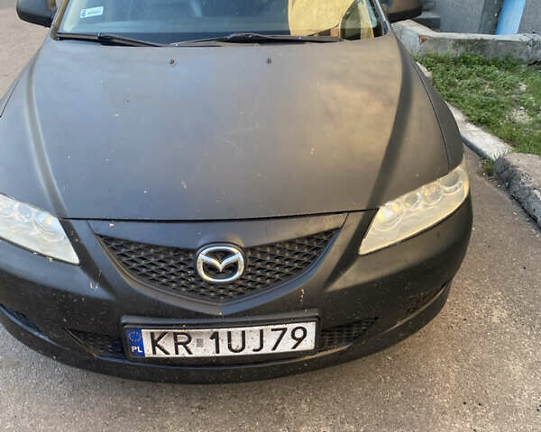 Черный Мазда 6, объемом двигателя 1.8 л и пробегом 290 тыс. км за 1800 $, фото 1 на Automoto.ua