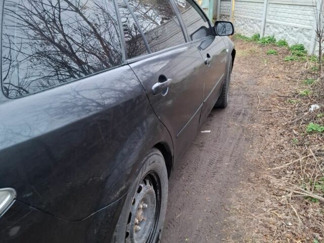 Черный Мазда 6, объемом двигателя 2 л и пробегом 362 тыс. км за 2601 $, фото 6 на Automoto.ua