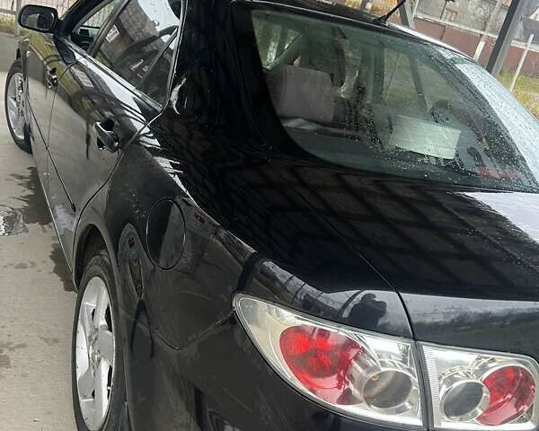 Черный Мазда 6, объемом двигателя 1.8 л и пробегом 173 тыс. км за 4200 $, фото 5 на Automoto.ua