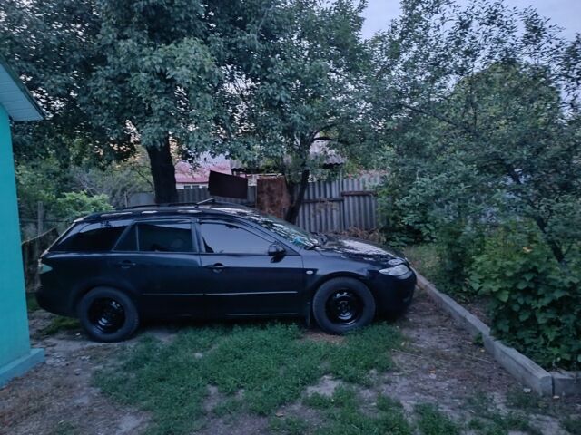 Черный Мазда 6, объемом двигателя 2 л и пробегом 362 тыс. км за 2601 $, фото 1 на Automoto.ua