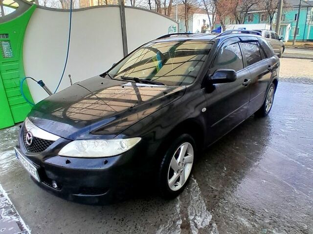 Черный Мазда 6, объемом двигателя 2 л и пробегом 293 тыс. км за 3800 $, фото 1 на Automoto.ua