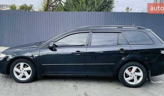 Чорний Мазда 6, об'ємом двигуна 2 л та пробігом 325 тис. км за 5500 $, фото 1 на Automoto.ua