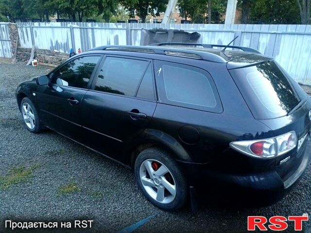 Черный Мазда 6, объемом двигателя 2 л и пробегом 250 тыс. км за 1800 $, фото 4 на Automoto.ua