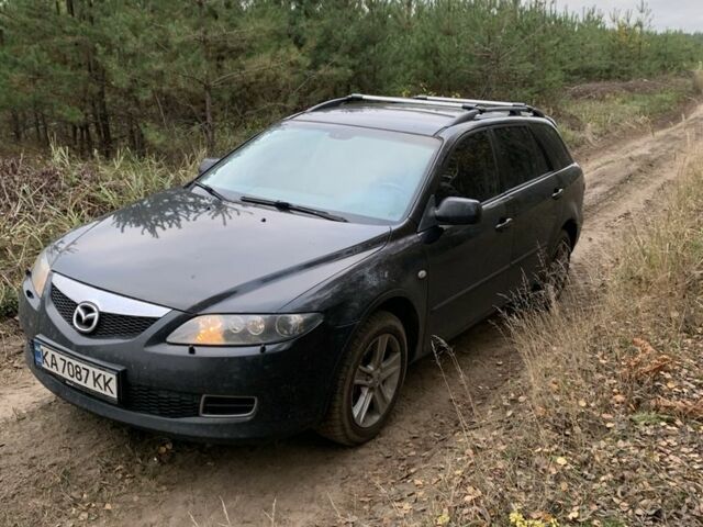 Черный Мазда 6, объемом двигателя 2.3 л и пробегом 300 тыс. км за 6000 $, фото 1 на Automoto.ua